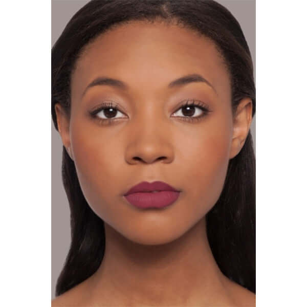 Charmed Plush Rush Satin Matte Lipstick (deep berry) on african american model