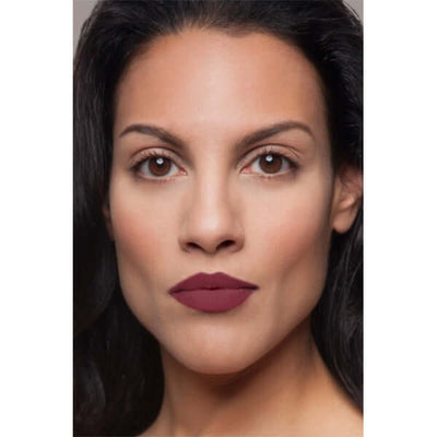 Charmed Plush Rush Satin Matte Lipstick (deep berry) on mixed ethnicity model