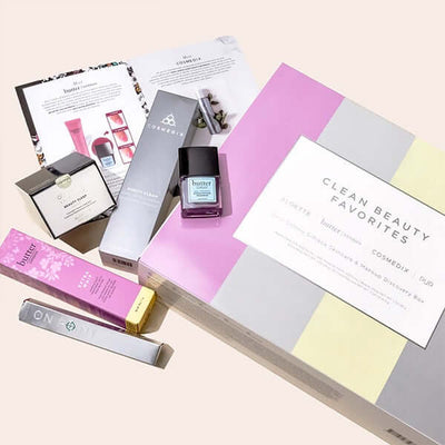 Box with all products, COSMEDIX Purity Clean Exfoliating Cleanser, butter LONDON Jelly Preserve Strengthening Treatment with a tinted Acai Berry color, Aloette Beauty Sleep Overnight Cooling Treatment, butter LONDON Extra Whip Hand and Foot Treatment with