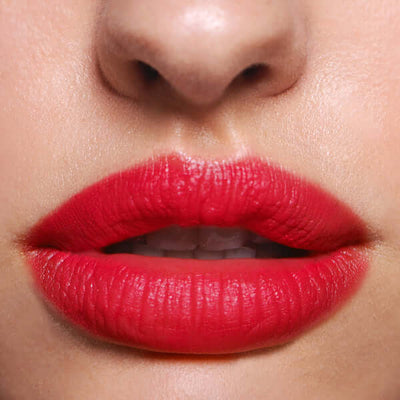 Bossy Boots Soft Matte Lip Cream (bright cherry red) on model